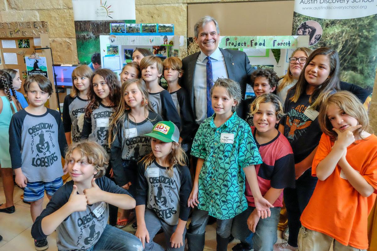 Mayor Steve Adler poses with students at the Student Innovation Showcase