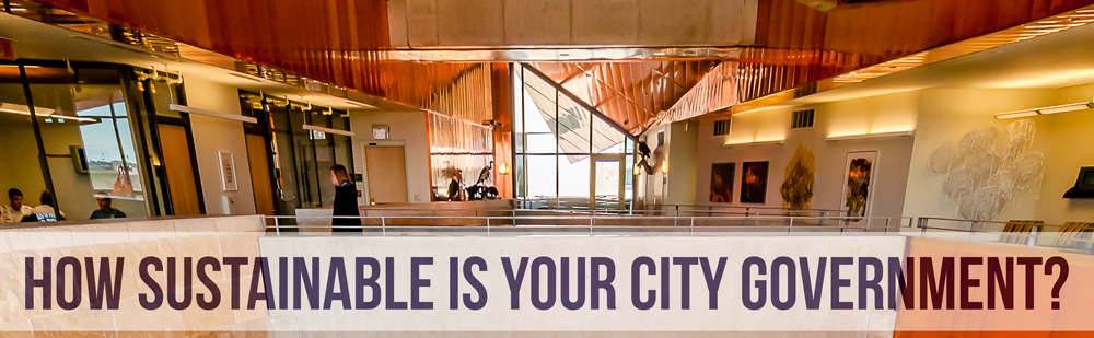 Text overlay: How sustainable is your city government? Photo background: City hall interior, gold and copper tones.