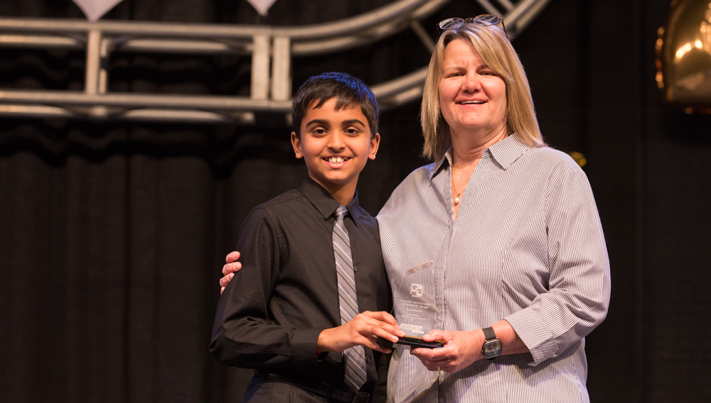 Pranav Sarma accepting an award at the Austin Energy Regional Science Fair.